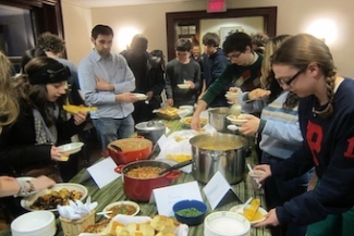 Photo of people gathered around a table