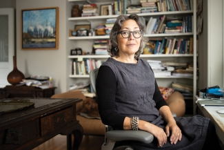 Professional photo of Lise Funderburg seated in her home library